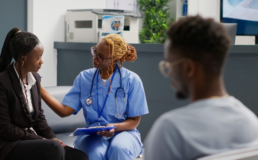 Medical nurse doing consultation with patient in waiting area, showing checkup forms to explain disease diagnosis. Health specialist trying to help woman with medication, exam clinic.