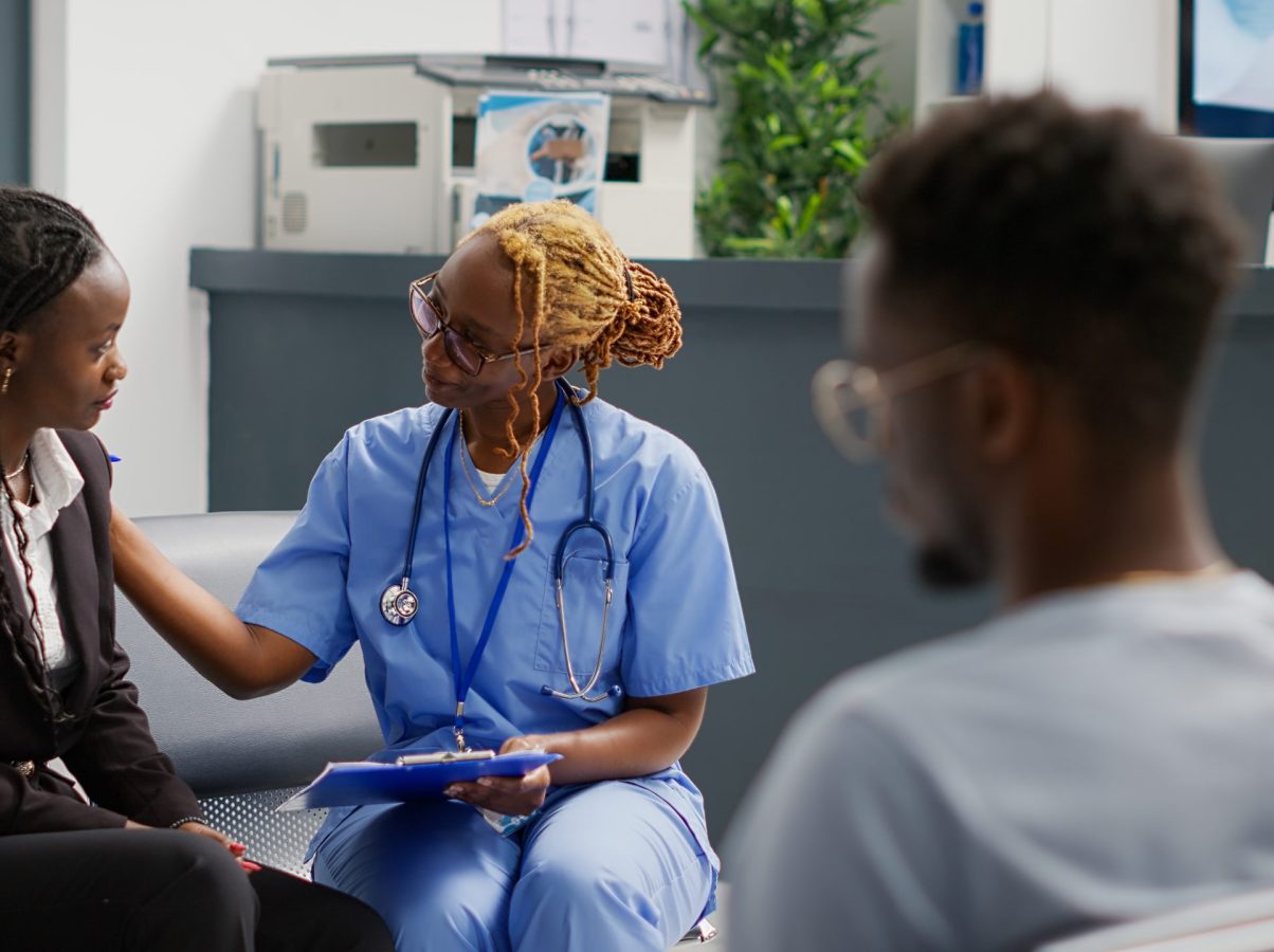 Medical nurse doing consultation with patient in waiting area, showing checkup forms to explain disease diagnosis. Health specialist trying to help woman with medication, exam clinic.