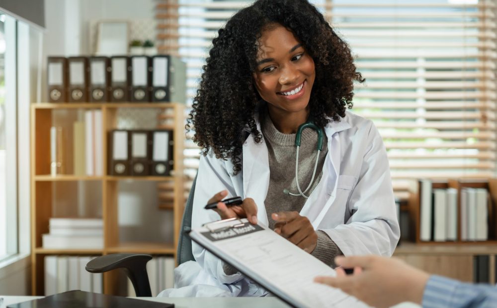 patient filling insurance legal document at appointment with doctor.  patient signing medical treatment contract, agreement form for taking medic care service, consultation, therapy