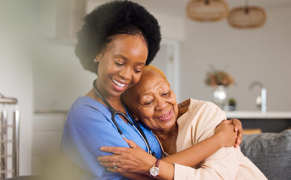 Black people, hug and nurse in elderly care for support, trust or healthcare in old age home. Happy.